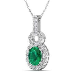 This exquisite oval-shaped emerald and diamond pendant exudes elegance and sophistication. Crafted with precision and attention to detail, this stunning piece features a vibrant emerald center stone surrounded by sparkling diamonds, creating a luxurious and timeless look. Metal: 14K Gold Setting Type: Prong Rhodium Finish: Yes, on White Gold Gemstone Details: Gemstone: Emerald Shape: Oval Average Dimensions: 8.00 x 6.00 MM Quantity: 01 Average Cut: Very Good Average Color: Medium to Dark Green A Oval Emerald Necklace With Diamond Accents, Oval Green Emerald Necklace With Diamond Accents, Fine Jewelry Diamond Emerald Necklace With Oval Pendant, Elegant Emerald Necklace With Diamond Halo Setting, Fine Jewelry Emerald Necklace With Oval Diamond Pendant, Oval Emerald Diamond Necklace In White Gold, Oval Emerald And Diamond Necklace, Emerald Necklace With Diamond Oval Pendant, Fine Jewelry, Emerald Oval Pendant Necklace