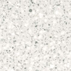 a white and gray speckled surface with small dots