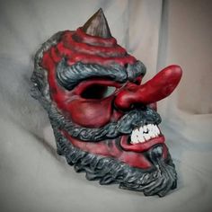 Red Tengu style maskBased off traditional Japanese Masks. Made of PLA and hand painted in acrylics. This mask is large enough to be wearable by most people.  Comes as mask only without straps.Inside dimensions are: 280 H x 150 W mm/   11 H x   6 W inOverall Dimension: 305 H x 190 W mm/  12 H x  7.5 W inEach piece is individually made to order so keep in mind: It will possibly take a couple weeks to paint and get it shipped out. The paint and coloring may differ slightly the picture, since each p Red Fantasy Masks And Prosthetics For Costumes, Fantasy Red Masks And Prosthetics For Costumes, Fantasy Red Masks And Prosthetics For Costume Events, Artistic Red Masks And Prosthetics For Costume Party, Red Fantasy Halloween Masks, Traditional Red Masks And Prosthetics For Costume Party, Red Cosplay Mask For Carnival, Artistic Red Masks And Prosthetics For Costume, Artistic Red Mask For Costume Party