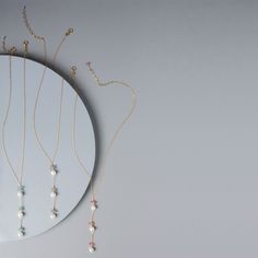 We wanted to design a non-traditional mom necklace. We chose pearls because of the natural way they're made (inside oysters) - reminds us of pregnancy. Pearls are also said to have a calming affect on the wearer and the more stress relief we can get as moms, the better. Aquamarine is our baby boy 'blue' stone for its calming properties and its link to happiness. Pink tourmaline is our baby girl 'pink' accent stone. It has positive properties of love, joy and happiness.- Y design with 3 white fre Necklace Collection, Tourmaline Necklace, Mom Necklace, Pearl Pendant Necklace, Boy Blue, Tourmaline Gemstone, Quartz Necklace, Gold Pendant Necklace, Unique Necklaces