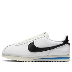 The Nike Cortez 'White Black Light Photo Blue' is a stylish silhouette that is perfect for any activity. The sleek white leather sole is complemented by a black Swooshe and heel, making it a timeless classic. The inspiration behind the design is the classic Cortez series, which has been around since the early 70s. This sneaker is sure to make a statement with its unique color combination of white, black, light photo blue, sail and team orange. It's the perfect addition to any wardrobe. (SNKR/Low Nike Leather Sole Sneakers With Round Toe, Nike Leather Sneakers With Leather Sole, Classic Sneakers With Contrasting Heel Counter For Sports, White Retro Sneakers With Contrast Sole, Retro White Sneakers With Contrast Sole, Spring Streetwear Sneakers With Leather Sole, Leather Sole Sneakers For Spring Streetwear, Sporty White Sneakers With Rubber Heel Cap, Sporty Synthetic Sneakers With Leather Sole