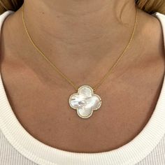 Turn heads in our Mother of Pearl Clover Necklace! This eye-catching piece shimmers beautifully in the light and is guaranteed to make you feel empowered when you wear it. Brazilian Gold Filled Mother of Pearl 18 inch necklace 1 1/2" width and length of pendant Long Mother Of Pearl Necklaces As Gifts, Mother Of Pearl Long Necklace For Gifts, Spiritual White Clavicle Chain Necklace, Spiritual Mother Of Pearl Pendant Necklace, White Gemstone Necklace With Mother Of Pearl, Spiritual Teardrop Pendant Necklace, Gold Mother Of Pearl Flower Pendant Jewelry, Elegant Large Pendant Mother Of Pearl Jewelry, Flower Pendant Gemstone Necklace