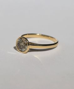 A Salt & Pepper Cognac diamond in a high bezel setting revealing the side profile of the ring. Specifications: Approx 1ct (1.18ct) round double cut salt and pepper diamond, in a high bezel setting, in 14k yellow Custom sized in approx. 10-14 days. Please contact us about rush orders. Timeless Lab-grown Diamond Ring With Rose Cut Diamonds, Timeless Everyday Diamond Ring With Round Cut, Everyday Timeless Round Cut Diamond Ring, Rose Cut Lab Grown Diamond Ring, Classic Everyday Diamond Ring With Single Diamond, Classic Single Diamond Ring For Everyday, Classic Everyday Single Diamond Ring, Heirloom Solitaire Diamond Wedding Ring, Everyday White Gold Diamond Ring