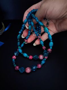 Beautiful handmade double strand choker necklace with various semi-precious stones. For the central part I used two different shapes of chrysocolla. To create the color contrast I used pink labradorite and quartz. The back part is made with agate beads. The necklace is very beautiful due to the contrast created between the blue and pink. The necklace is very elegant but at the same time has a touch of retro style, perfect for warm autumn evenings. The necklace is 47cm long and has a lobster clasp with a 7cm extension. Perfect for those who love boho and elegant style. All jewels are delivered in a decorated box, ready to be given as a gift to your loved one. How to take care of your jewellery: put on your beauty products (cosmetics, perfumes, ...) before wearing your precious jewel. Clean Blue Double Strand Spiritual Necklace, Blue Multi-strand Gemstone Necklaces, Blue Gemstone Multi-strand Necklaces, Turquoise Agate Faceted Bead Necklaces, Turquoise Agate Necklace With Faceted Beads, Turquoise Agate Faceted Beads Necklace, Blue Double Strand Gemstone Beads Jewelry, Blue Agate Jewelry With Colorful Beads, Blue Double Strand Natural Stones Jewelry