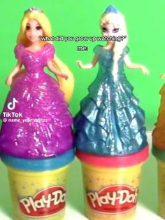 there are three toy ice cream cones with princesses on them