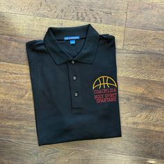 Are you a proud basketball coach? Show it, with our Personalized Basketball Coach Embroidered Polo Shirt! Perfect for any basketball coach, this stylish polo shirt is designed to give your coaching staff a professional yet fashionable look. With your name and a personalized basketball design embroidered on the left chest, this polo wants to make sure everyone knows who is in charge! It's made of breathable cotton/polyester fabric ensuring comfort as well as durability during long practices or ga Cotton Team Spirit Polo Shirt For Team Events, Cotton Polo Shirt For Team Events, Team Spirit Cotton Polo Shirt In Team Colors, Team-colored Cotton Polo Shirt With Team Spirit Style, Team Spirit Cotton Polo Shirt For Sports Events, Casual Team-colored Polo Shirt For Team Events, Team Spirit Cotton Polo Shirt For Sports Season, Team Meaning, Custom Polo Shirts