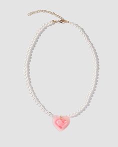 Details: Pearl necklace with front pink heart design Pink Heart-shaped Clavicle Chain Jewelry, Pink Heart-shaped Jewelry With Clavicle Chain, Pink Heart Necklace With Clavicle Chain For Valentine's Day, Valentine's Day Pink Heart Necklace With Clavicle Chain, Pink Heart Pendant Clavicle Necklace, Pink Heart Necklace On Clavicle Chain, Pink Heart Pendant Necklace With Clavicle Chain, Trendy Heart Beads Necklaces, Feminine Pink Pendant Jewelry