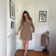 This is a gorgeous 90s does 70s faux wrap dress. Made of a brown and green stretchy fabric that has funky geometric circles and triangles all over it. the dress has a slight collar and belt loops but no belt. Has no size tag, but has quite a bit of stretch - see measurements in photos for best fit - approx a small. Brand is Donutz inc. very office siren aesthetic! Brown Fitted V-neck Wrap Dress, Retro Brown V-neck Dress, Fitted Knee-length Wrap Dress For Fall, Fitted Belted Mini Dress With Surplice Neckline, Fitted Mini Dress With Belted Surplice Neckline, Retro Fitted Brown Mini Dress, Brown Fitted Dress With Surplice Neckline, Fitted Mini Dress With Belt And Surplice Neckline, Fitted Mini Wrap Dress For Fall