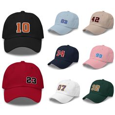 "Include the number of your favorite professional, college or varsity sports player on this custom number dad hat. It features a stylish, low-profile design and is available in 11 different colors with 15 embroidery stitch color options. Add your favorite hockey, football, soccer, baseball, racing or sports player number in the team colors of your choice. THIS IS A CUSTOM PRODUCT AND RETURNS ARE NOT ACCEPTED. PLEASE SELECT YOUR OPTIONS CAREFULLY. A MOCKUP WILL BE PROVIDED FOR YOUR APPROVAL BEFOR Embroidered Initials, Embroidery Stitch, Sport Player, Dad Cap, Dad Caps, Custom Jerseys, Winter Beanie, Baseball Team, Profile Design