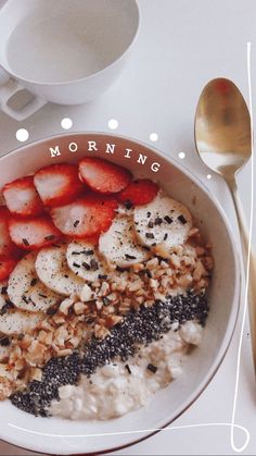 a bowl of oatmeal with strawberries, bananas and other toppings