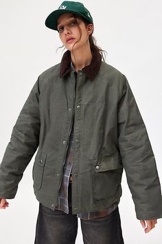 Staple BDG jacket in an oversized, chore style. Designed in a waxed canvas & lined in flannel featuring a contrast corduroy collar, long sleeves and front patch pockets. Topped with snap & zip closures for a functional and stylish finish. Find it only at Urban Outfitters. Features BDG George waxed barn jacket Canvas chore jacket Waxed canvas outer Contrast corduroy shirt collar with long sleeves Front patch pockets with snap placket Oversized, relaxed fit Tunic length Flannel lining Snap and zip Capitol Hill Style, Waxed Canvas Jacket, Everyday Jacket, Barn Coat, Barn Jacket, Worker Jacket, Waxed Cotton Jacket, Fall Wardrobe Essentials, Fitted Tunic