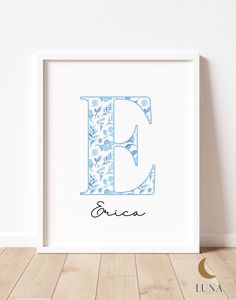 the letter b is made up of blue flowers and leaves, with the name aria written in cursive font