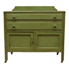 a green cabinet with two doors and three drawers