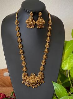 An elegant set for your local gatherings or parties. The length of the antique kemp AD haram is given in one of the pictures. Measurements of the jhumkas. Height: 5.5 Cm  Width : 3.5 Cm  Care Instruction : Avoid Heat & Chemicals Like Perfume, Deo, Alchol, Etc. | Clean With Dry Cotton Cloth | Pack In our Anti tarnish box after use. Lakshmi Haar Gold, Mid Length Haram Gold, Long Temple Jewellery Necklace, Luxury 22k Gold Hallmarked Temple Necklace, Luxury Gold Temple Jewelry Beads, Antique Gold Haram Designs, Temple Necklace Jewellery, 32 Grams Gold Haram Designs, Antic Jewellery Designs