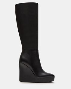 The AKIRA knee-high boot features a platform wedge design and a convenient inside zipper for easy on and off. Elevate your style game with this versatile and stylish boot, perfect for any occasion. 4.5 inch heel height Size 6 measurements: 14 inch shaft circumference, 13.75 inch shaft height Size 8 measurements: 15 inch shaft circumference, 14.75 inch shaft height Size 10 measurements: 16 inch shaft circumference, 15.75 inch shaft height Leather upper material Textile lining Synthetic sock Synth Black Wedge Boots, Knee High Platform Boots, Platform Boots Women, Summer Wardrobe Staples, Steve Madden Boots, Shoes Sandals Heels, Black Wedge, Stylish Boots, 5 Inch Heels