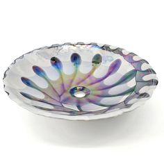 a glass bowl shaped like a flower on a white background