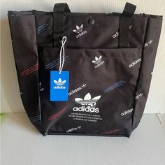 Adidas Originals Simple Tote Bag Multi Graphic Black (15x14) Nwt Black Tote Bag With Logo, Black Shoulder Bag With Logo And Double Handle, Black Rectangular Shoulder Bag With Logo, Black Shoulder Bag With Logo For Errands, Casual Black Bags With Logo, Black Shoulder Bag For Errands With Dust Bag, Black Tote Bag For Errands, Black Satchel Bags With Reinforced Handles, Black Bag With Zipper Closure For Errands