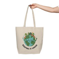 This tote bag will be the best companion on weekly shopping trips and is eco-friendlyl at the same time. It's made from natural, 10 oz./yd² cotton canvas fabric that is extremely durable and spacious with two comfortable shoulder straps. Material: 10oz./yd² natural cotton canvas fabricOne size: 18" x 15" (45.7cm x 38.1cm)Easy-carry handles and a spacious bottom 18" x 15" Width, in 17.99 Height, in 15.00 Total handle length, in 30.00 Refund / Exchange Policy: Since products are only printed once Recyclable Cotton Bags In Natural Color, Recyclable Natural Cotton Bag, Recyclable Natural Cotton Bags, Green Tote Bag With Eco-friendly Ink, Green Eco-friendly Canvas Shopping Bag, Eco-friendly Green Canvas Shopping Bag, Eco-friendly Recyclable Canvas Tote Bag, Recyclable Cotton Shoulder Bag For Travel, Organic Recyclable Canvas Tote Bag