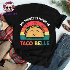 Product details: ✔️ NAME: Cinco De Mayo Shirt Mexican Outfit Taco Belle T-shirt, Taco T-shirt, Cinco De Mayo Shirt, Funny Foodie Gift, Funny Shirt, Mexican Shirt Gift. ✔️ IMPORTANT NOTE: Both Men and Women can we our shirts because this is unisex style t-shirts;  Wash item inside out in cold water, do not bleach, do not dry clean, do not iron directly on the design. ✔️ MATERIAL: 5.3-ounce, 100% cotton (99/1 cotton/poly (Ash) & 90/10 cotton/poly (Sport Grey); Heavyweight classic unisex tee; Taped Taco Tshirt, Mexican Shirt, Fiesta Shirt, Family Cruise Shirts, Mexican Shirts, House Graphic, Mexican Outfit, Taco Shirt, Style T Shirts