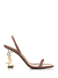 Brown vegetable-tanned leather "Opyum" sandals from Saint Laurent, featuring a square almond toe, an adjustable back strap and a structured Cassandre heel. Luxury Sandals With Sculpted Heel And Square Toe, Designer Calf Leather Slingback Sandals With Open Heel, Designer Calf Leather Slingback Sandals, Luxury Open Toe Slingback Sandals With Sculpted Heel, Summer Calf Leather Slingback Sandals With Sculpted Heel, Designer Slingback Sandals With Sculpted Heel, Luxury Calf Leather Slingback Sandals, Luxury Calf Leather Slingback Sandals With Block Heel, Luxury Slingback Sandals With Branded Heel Counter