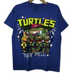 Classic Graphic Short Sleeves Tee Featuring The Teenage Mutant Ninja Turtles. Brand New Without Tags! No Flaws. Official Licensed Product. We Are A Smoke-Free And Pet-Free Home. J Blue T-shirt With Character Print For Streetwear, Blue Fan Apparel Tops With Character Print, Blue Crew Neck Top With Pop Culture Style, Blue Tops With Character Print For Fans, Blue Character Print Fan Apparel Tops, Blue Pop Culture Tops With Graphic Print, Blue Crew Neck Tops In Pop Culture Style, Blue Crew Neck Top In Pop Culture Style, Blue Character Print Tops For Fans