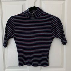 Brandy Short-Sleeve Turtle Neck Navy Blue, Red, And White Hardly Worn, Bought Nwt From Another Posher But I Just Don’t Wear It Anymore. Ask Me Questions! Striped Short Sleeve Tops For Fall, Retro Fitted Blue Tops, Blue Retro Fall Tops, Blue Retro Tops For Fall, Retro Blue Tops For Fall, Striped Fitted Tops For Fall, Fitted Striped Tops For Fall, Tops Brandy Melville, Brandy Melville Tops