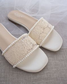 Crochet flat sandals for classic and dressy look with added mini pearls. Simple and easy wear for brides, bridesmaids and wedding parties.DETAILS:COLORS AVAILABLE: White & IvoryUPPER: Synthetic upper and liningMATERIALS: Mandmade outsole STYLE NAME: ASHLEY Crochet Flats, Slip On Sandals, Wedding Parties, Lace Slip, White Crochet, Wedding Classic, Easy Wear, Crochet Lace, Flat Sandals