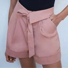 Nwot Zara Pink Marl High Waisted Shorts W/ Bow Size: Xs Color: Rose/Pink Excellent Condition. New Without Tags Belt Is Attached Brand New Zara Shorts W/ Bow Trf In Pink Marl High-Waisted, Self Tie Shorts W/ Foldover Waist, Side Pockets, Back False Welt Pockets & Cuffed Hem Front Zip W/Metal Hook Closure Mixture Of Cotton (97%) & Elastane (3%) Length: 15” Waist: 12.5” Rise: 12” Inseam: 2.5” 97% Cotton 3% Elastane Smoke Free Home Ships Same Day Or Next Business Day Bundle And Save! Open To Reasona Trendy Solid Color Shorts For Spring, Trendy Solid Color Spring Shorts, Pink High-waisted Shorts With Pockets, Beige High-waisted Shorts, Chic High-waisted Shorts In Solid Color, Chic High Waist Shorts With Waistband, Chic High Waisted Shorts With Waistband, Chic Solid Color Short Bottoms, Chic High-waisted Solid Color Shorts