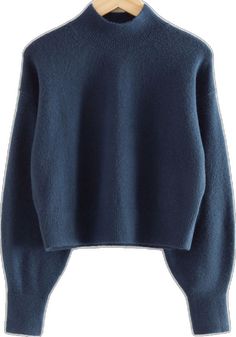 a blue sweater is hanging on a wooden hanger and it's not too long