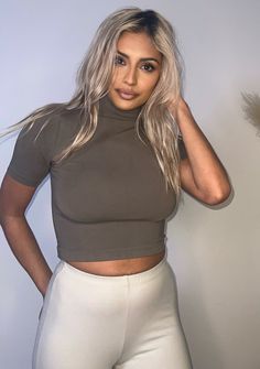 Our elegant and stylish mid-sleeve turtleneck crop top is made with luxurious modal fabric, it has an elegant soft and stretchy design that gives it a sophisticated vibe. Great for workwear or social outings. 🖤 Model wearing size S/M 78% Modal 17% Nylon 5% Spandex Short Sleeve Crop Top For Fall, Fitted Trendy Mock Neck Top For Work, Trendy Fitted Mock Neck Top For Work, Trendy Fitted Mock Neck Top For Night Out, Trendy Stretch Mock Neck Top For Workwear, Fitted Casual Cropped Mock Neck Top, Chic High Neck Crop Top With High Stretch, Trendy High Neck High Stretch Crop Top, Spring Chic Turtleneck Crop Top