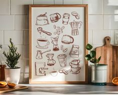 a kitchen with oranges and an art print on the wall next to a potted plant