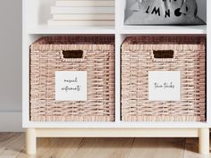 two wicker baskets sitting on top of a white book shelf next to a wall