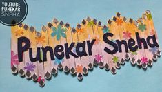 a wooden sign that says punekar shehad with flowers and leaves on it