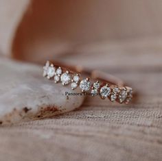 a close up of a ring with diamonds on it