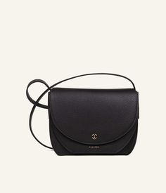 Choose timeless sophistication with the Magnolia, our black shoulder bag. Handcrafted in Italy from grained calf leather, this bag brings unparalleled elegance to your wardrobe for all occasions. Gold Models, Scarf Headband, Metal Accessories, Black Shoulder Bag, Leather Care, Plastic Bag, Saddle Bags, Patch Pocket, Magnolia