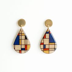 Mondrian Geometric Earrings, Statement Earrings, Modern Earrings, Wood Earrings, Colorful Earrings, Wooden Earrings, Modern Art,Gift for Her Matching bracelet is available here: https://www.etsy.com/listing/689764160/mondrian-bracelet-modern-bracelet?ref=shop_home_active_7&frs=1 Mondrian inspired pattern image is set onto teardrop wood charms. You can see the wood partially through the image. The front side is coated with resin for extra protection. The earring post is stainless steel and go Modern Teardrop Plug Earrings As Gift, Modern Teardrop Plug Earrings For Gift, Modern Multicolor Single Earring, Handmade Modern Teardrop Earrings, Artistic Yellow Teardrop Earrings, Modern Multicolor Earrings As Gift, Modern Multicolor Earrings As A Gift, Modern Multicolor Dangle Earrings, Modern Multicolor Earrings For Gift