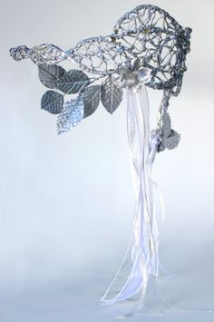 "Inspired by the headpiece worn by Sarah (played by Jennifer Connelly) in the masquerade ball scene in the 1986 movie \"Labyrinth.\" The piece is made with an copper wire skeleton, that is covered with hot glue in a manner to replicate the vine-like quality of the original. This also allows the piece to be bent into shape so that it can fit any head. The piece is accentuated with acrylic rhinestones, a variety of silver and white ribbons, and silver flowers and leaves. Here is an image from the Fantasy Crown For Masquerade, Fantasy Crown Masquerade Costume Accessories, Silver Fantasy Headpiece For Costume Party, Silver Crown Headpiece For Costume Party, Silver Fantasy Party Headpiece, Fantasy Masquerade Costume Headband, Fantasy Masquerade Headband Costume, Fantasy Style Masquerade Costume Headband, Silver Fantasy Crown Headpiece