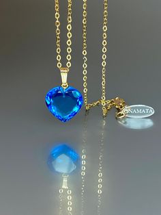 Gorgeous sparkly London blue topaz heart pendant necklace. The Faceted heart shape pendant is flawless and has the most vivid blue color that brings lots of depth to the stone and reflects lights beautifully. The pendant is strung on a 14K goldfilled chain. It is perfect for layering or looks great when worn alone. *Excellent quality: AAA+ Flawless Swiss blue topaz Heart Shape Pendant *Pendant measure: 23mmx15 mm /0.9x 0.6 inch *Metal: 14K gold-filled *necklace length: 45 cm /18 inch Solid gold, Heart Shaped Sapphire Jewelry For Gifts, Sapphire Gemstone Necklace For Valentine's Day, Heart Shaped Sapphire Jewelry Gift, Heart-shaped Sapphire Jewelry Gift, Heart-shaped Sapphire Necklace For Gift, Heart Cut Sapphire Jewelry Gift, Heart Cut Sapphire Necklace Gift, Heart Cut Sapphire Jewelry For Gifts, Heart Cut Sapphire Necklace As Gift