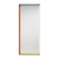 an orange and white framed mirror against a white wall