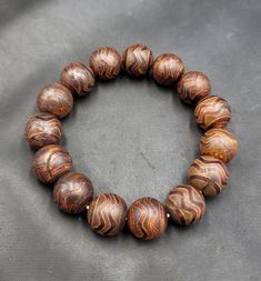 Ancient Powerful  Agate Stone Sulimani Wonderful Very Old Beads Baraclet Adjustable Its Beautiful Quality Bracelet Sulimani Agate Stone Beads Baraclet Traditional Brown Beaded Bracelet With Natural Stones, Traditional Brown Beaded Bracelets With Natural Stones, Traditional Bracelets With Natural Stones For Meditation, Artisan Wooden Beads Bracelets For Meditation, Traditional Beaded Bracelets With Natural Stones For Healing, Traditional Agate Bracelets For Healing, Artisan Beaded Bracelets For Meditation, Artisan Brown Hand-strung Beaded Bracelets, Artisan Brown Beaded Bracelets With Large Beads