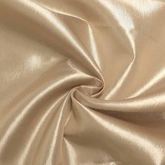 a close up view of a shiny gold fabric