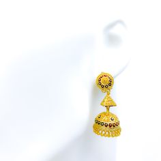 Experience a splash of color with these Jhumki earrings, featuring intricate Meenakari work set in radiant 22k yellow gold. Weighing approximately 17.1 grams and spanning a length of 1.3", they are a testament to fine craftsmanship. The earrings dangle beautifully, secured by a dependable hook back. Product Details Gold Purity(karat): 22k Gold Weight(grams): 17.1 Item Finish: Yellow Gold Earring Style: Hanging/Jhumki Earring Length: ﻿1.3﻿" Earring Post: Hook Back Jhumki Earrings, Earring Post, Gold Earring, Yellow Gold Earring, Earrings Dangle, 22k Gold, Post Earrings, Fashion Earrings, Color Splash