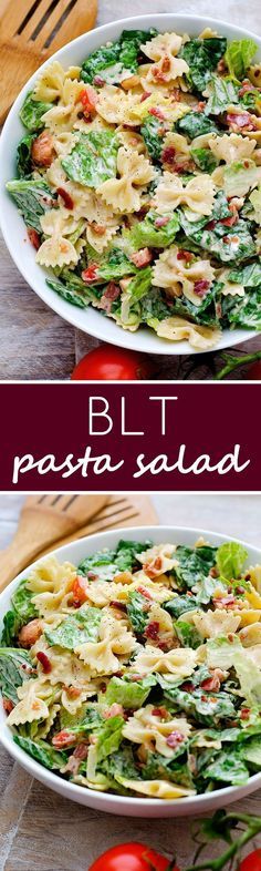 two plates filled with pasta salad on top of a wooden table