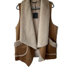 Nwt Do Everything In Love Faux Fur Vest, One Size Features Brand New, Nwt Sleeveless, Open Front Faux Fur Vest Super Soft Heavier Item, Perfect For Fall/Winter Big Pockets - Condition: Nwt, Never Been Worn - Material: Faux Fur, 100% Polyester - Size: One Size Fits Most - Fit: Best For Size M-Xl - Color: Tan, Cream, Beige - Measurements: P To P 22" Length 28-29" - Additional Details: Cat-Friendly Home (Items Kept Away From Pets). Items Are Cleaned And Steamed Prior To Shipment. - Shipping: Ships Brown Vest With Faux Fur Trim For Fall, Faux Fur Coat Vest Leather, Brown Sleeveless Vest With Faux Fur Lining, Brown Faux Fur Outerwear With Pockets, Luxury Faux Fur Vest, Do Everything In Love, Big Pockets, Cat Friendly Home, Faux Fur Vest