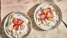 two bowls filled with dessert sitting on top of a table next to a pink towel