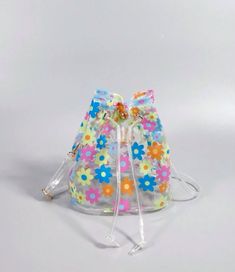 Introducing our Flower Power Jelly Bags - the ultimate beach accessory! This clear bucket bag features a colorful flower design that perfectly matches our icon espadrille sandals. Keep your swim and beachwear organized and in style with this must-have bag. Don't settle for anything less when it comes to your beach day essentials. Jelly Bags, Picnic Snacks, Waterproof Beach Bag, Chic Crossbody Bag, Clear Purses, Jelly Bag, Beach Tote Bag, Beach Sports, Drawstring Bucket Bag