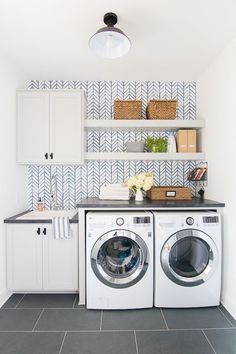 a washer and dryer in a small room