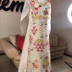 Gown Like Dress Spring Formal Gown With Intricate Embroidery, Elegant Long Gown With Floral Embroidery, Elegant Spring Gown With Intricate Embroidery, Festive White Maxi Dress For Wedding, Fitted Anarkali Dress With Intricate Embroidery, Organza Gown With Dabka Work In Maxi Length, Evening Gown With Dabka Work In Maxi Length, Evening Gown With Dabka Work Maxi Length, Elegant Maxi Gown With Floral Embroidery