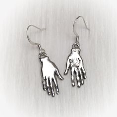 Palmistry Fortune Teller earrings. Pewter hand charms on your choice of silver plated or gold plated brass ear hooks: * Fish hook * Lever back * Kidney (47mm, will fit through stretched ear tunnels) * Post-style * Clip on (non-piercing)  * Sterling Silver Fish hooks * 14K Gold-Filled Fish hooks NOTE: If you select the .925 sterling fish hooks, but 'gold' charms, the ear hooks will be silver not gold. (Alternatively if you select 14k GoldFilled hooks and 'silver' charms, the hooks will be gold) ..: V I E W  S H O P:.. www.lotusfairy.etsy.com www.shopEarthshine.com ..: P O L I C I E S :.. Please see the drop down FAQs menu All items are FINAL SALE. ★  I M P O R T A N T  ★ This product is not intended to be used by, or around,  anyone under the age of 13.  ShopEarthshine.com ★ lotusfairy.etsy Adjustable Dangle Clip-on Earrings As A Gift, Adjustable Dangle Clip-on Earrings For Gift, Adjustable Hand Cast Earrings As Gift, Nickel-free Brass Dangle Clip-on Earrings, Symbolic Dangle Jewelry With Ear Wire, Nickel-free Novelty Drop Earrings, Adjustable Clip-on Earrings With Ear Wire As Gift, Hand-cast Brass Dangle Earrings, Adjustable Sterling Silver Clip-on Earrings