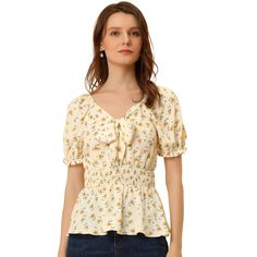 Not only does this top have a cozy fabric, but it also features a chic and lovely floral print. This is a very stylish printed shirt. This top can bring instant romance to any look of yours. Whether at the beach or in the town, this floral-printed shirt is perfect for any occasion. Buy it and brighten up your wardrobe. Spring Floral Print V-neck Smocked Top, Floral Print V-neck Smocked Top For Brunch, Non-stretch Feminine Blouse With Floral Print, Feminine Floral Smocked Top For Fall, Feminine Fall Smocked Top With Floral Print, Casual V-neck Top With Ditsy Floral Print, Chic Floral Print Smocked Top For Spring, Chic Spring Floral Smocked Top, Non-stretch Printed Casual Blouse